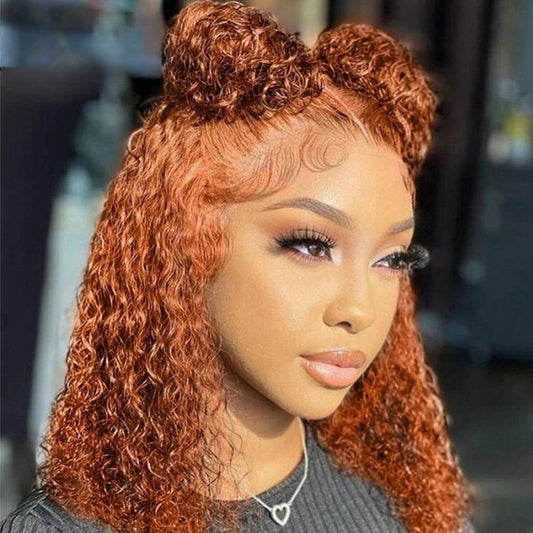 A woman wearing an orange red water wave bob wig with voluminous curls and a chic bob cut.