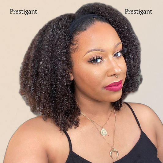 A woman wearing a twisted Afro headband wig with a natural black color, labeled 'Prestigant'.